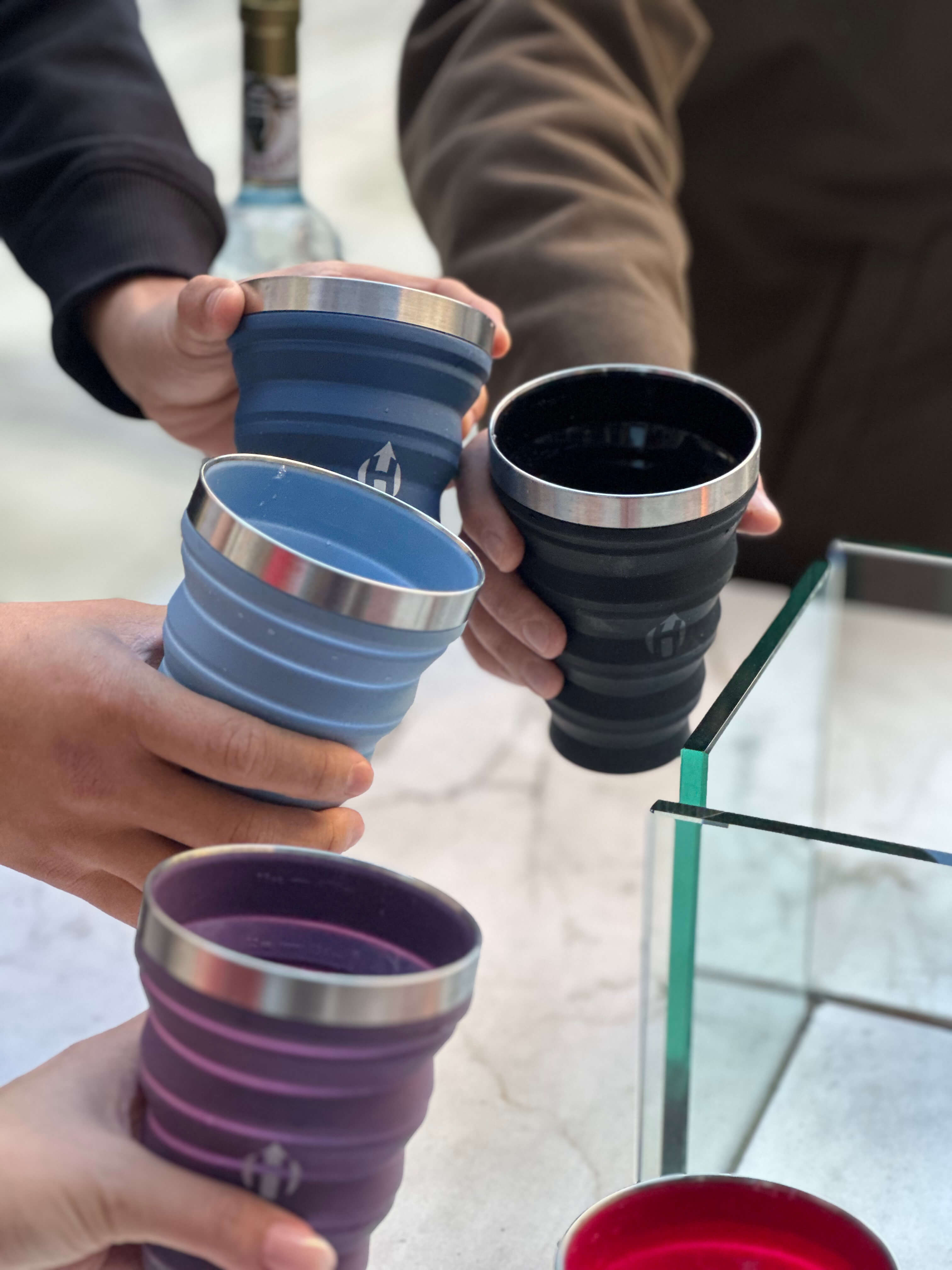 HYDAWAY collapsible pint cup is a 16oz (473ml) silicone beer cup and reusable drinkware with a stainless steel rim cup design that folds into a pocket pint glass, making it a foldable camping cup, travel drink cup, and festival cup as a BPA free collapsible cup and eco friendly pint.